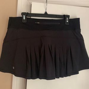 Super cute Lululemon tennis shirt with back ruffles/pleats! Size 12.